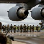 Picture of troops loading onto a plane