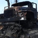 Picture of an abandoned and destroyed car